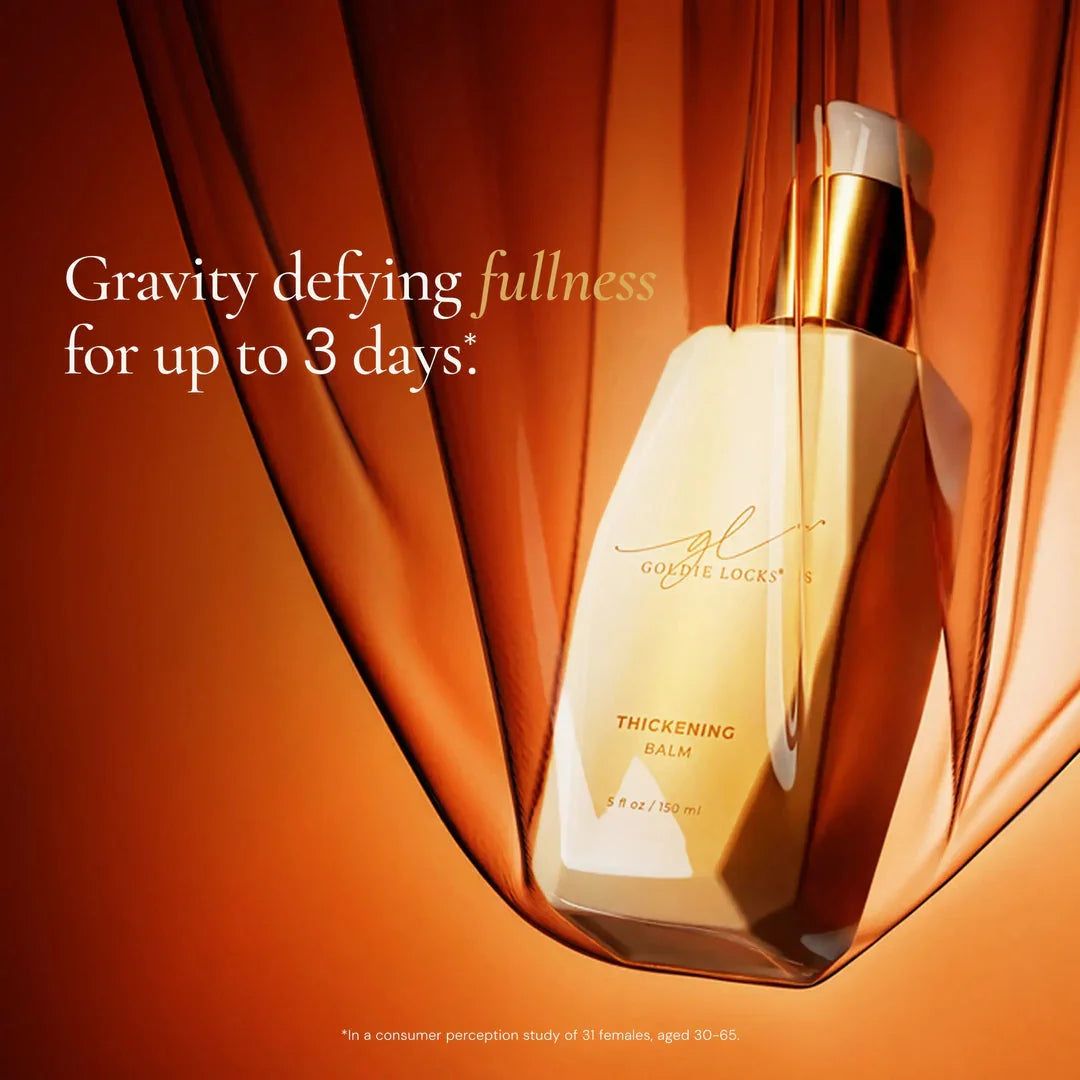 Goldie Locks thickening balm bottle on gold background, hair care product for fuller hair in Delray Beach FL.