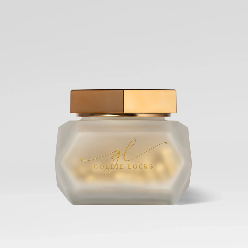 Goldie Locks hair care supplement in frosted jar with gold lid, Delray Beach FL luxury studio