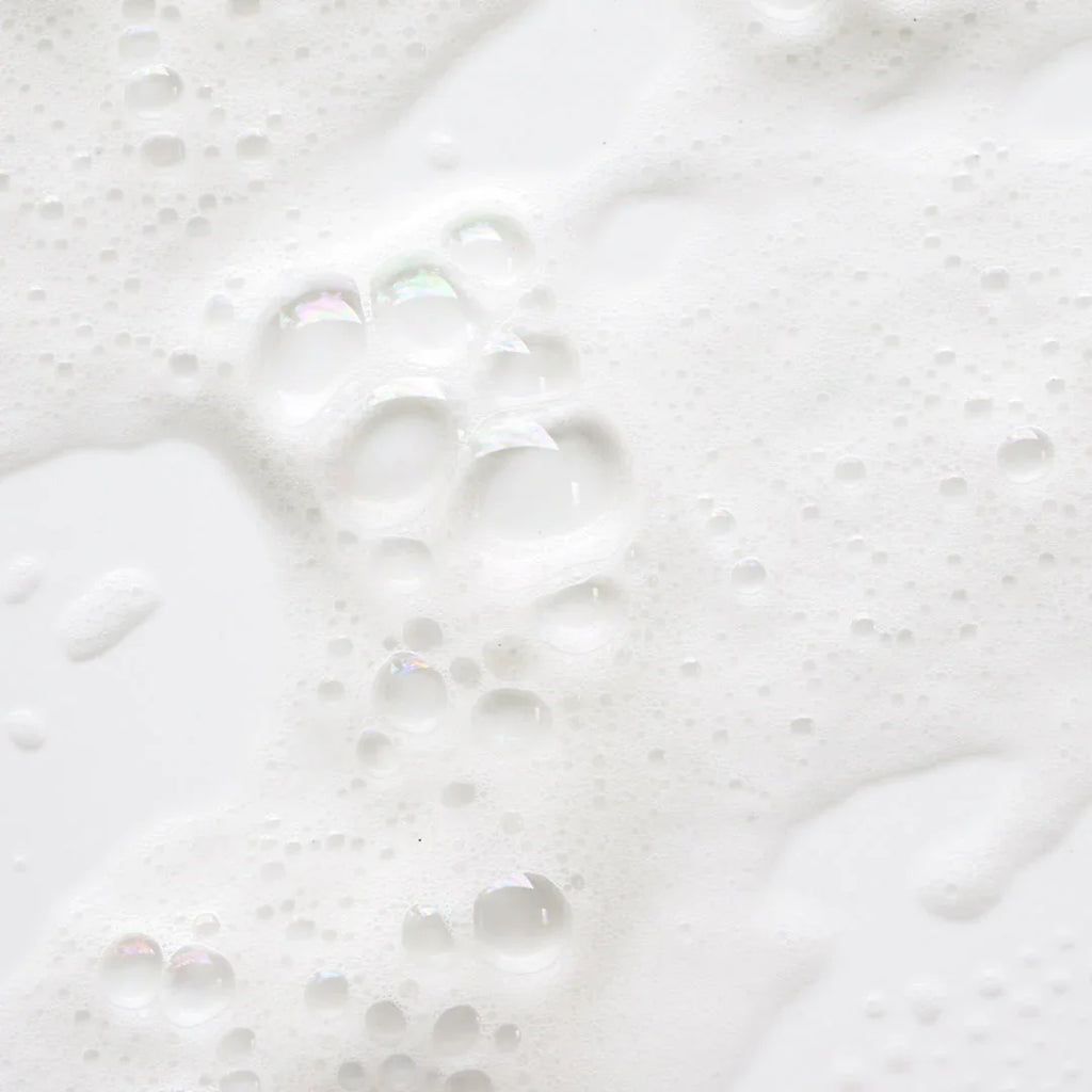 Close-up of rich foamy shampoo lather, ideal for hair extensions care in Delray Beach FL