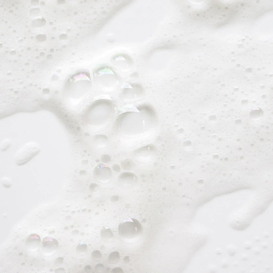 Close-up of rich foamy shampoo lather, ideal for hair extensions care in Delray Beach FL