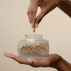 Hand holding Goldie Locks hair care supplement jar for hair transformation in Delray Beach FL